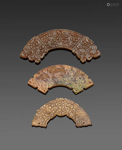 a group of Three archaistic plaques, huang