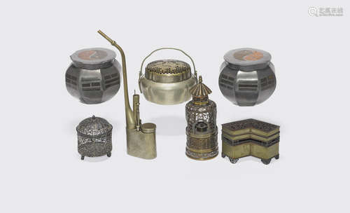 A group of seven metal alloy objects