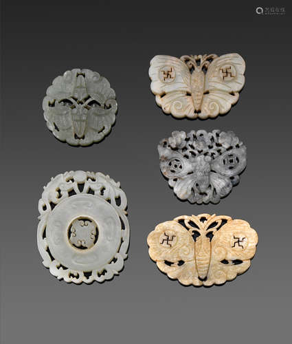 A group of five reticulated jade plaques