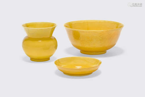 Guangxu and Xuantong six-character marks and of the period a group of Three yellow porcelain vessels