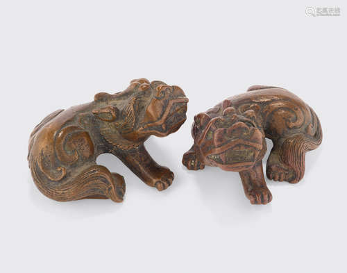 A pair of bronze mythical beasts