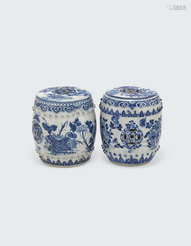 Two small blue and white garden stools