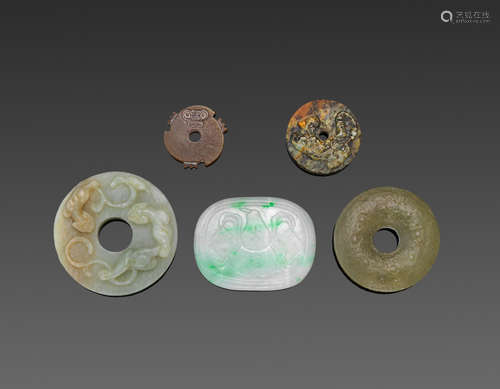 A group of five jade bi disks and carvings