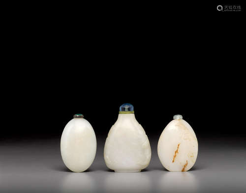 a group of Three nephrite snuff bottles