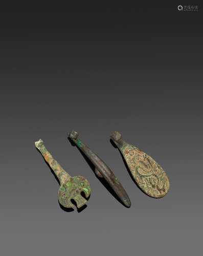 A group of three bronze archaistic belt hooks