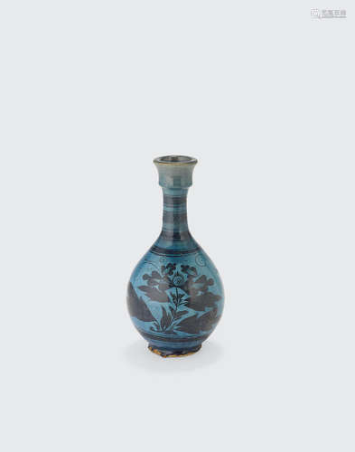 A turquoise glazed bottle vase with black slip decoration