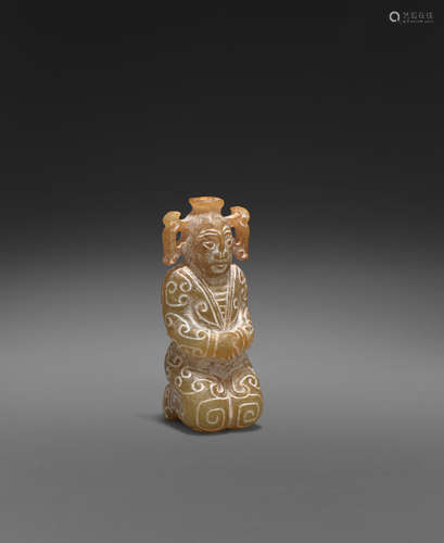 An archaistic jade carving of a kneeling figure