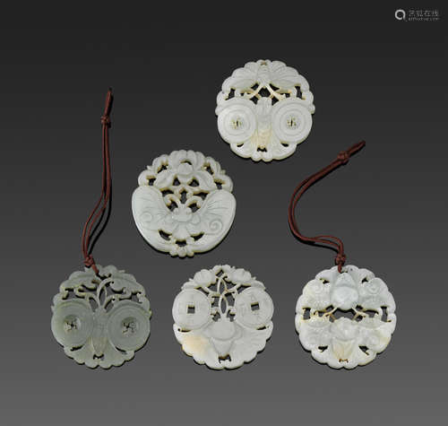 A group of five jade circular pendants with butterfly decoration