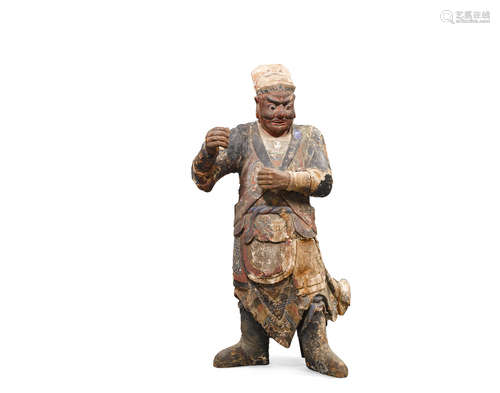 Qing dynasty A carved polychrome lacquered wood figure of a Guardian