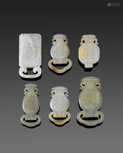 a group of Six jade belt slides inscribed with shuangxi characters