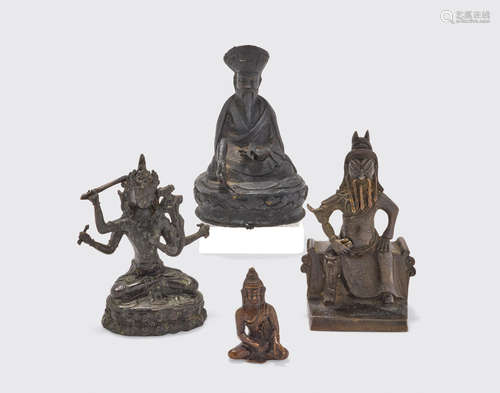 A group of four cast metal alloy statues