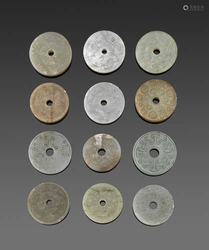 a group of Twelve jade and hardstone bi disks