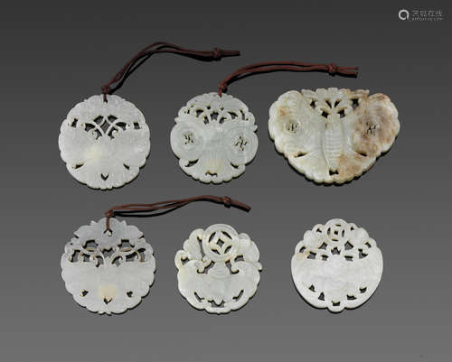 a group of Six reticulated jade plaques