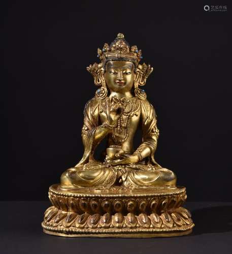 Buddha Amoghasiddhi. Rare Tibeto- Chinese gilt bronze statue.