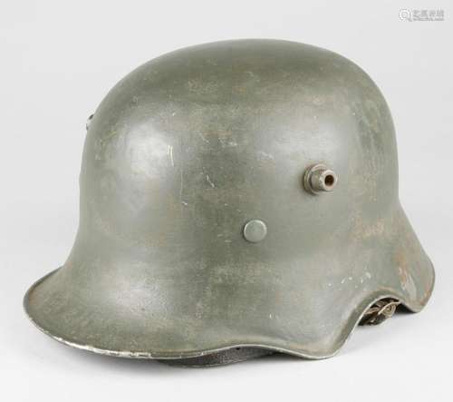 M 17 steel helmet with ear cutout.