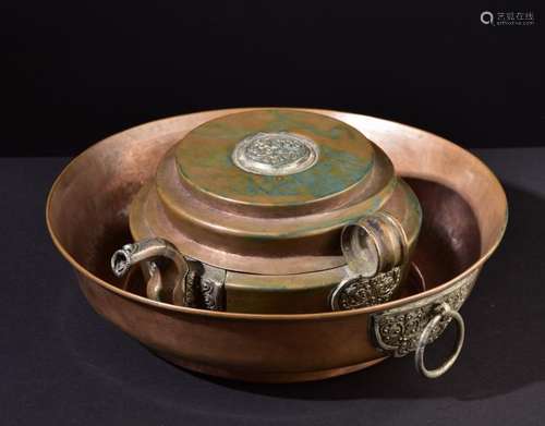 Holy water pot and basin. Old Tibetan Buddhist ritual items.