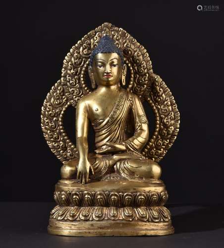 Buddha Shakyamuni. Fine Tibetan gilt bronze statue with mantra inscription.