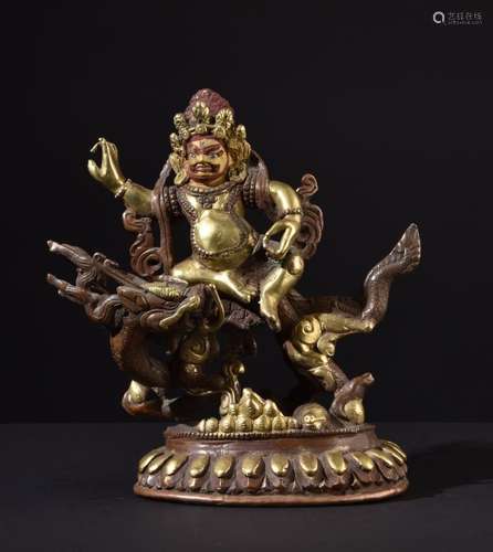 White Jambhala on Dragon. Old Tibetan gilt copper bronze Buddha statue.