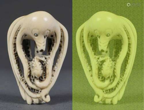 [X] KATABORI NETSUKE EN IVOIRE SCULPTE A L'EFFIGIE D'UNE PIEUVRE, TAKO