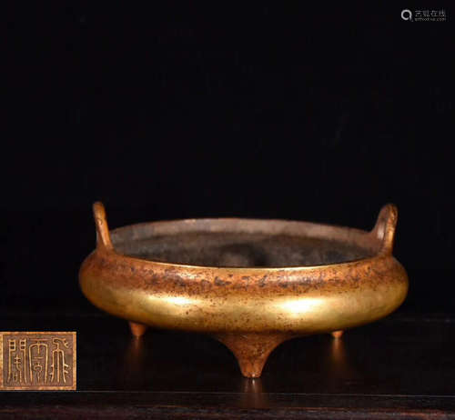 A GILT BRONZE MOLDED TRIPOD CENSER WITH MARK