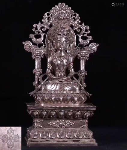 A SILVER MOLDED SAKYAMUNI BUDDHA STATUE