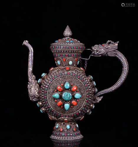 AN OLD TIBETAN SILVER WINE POT