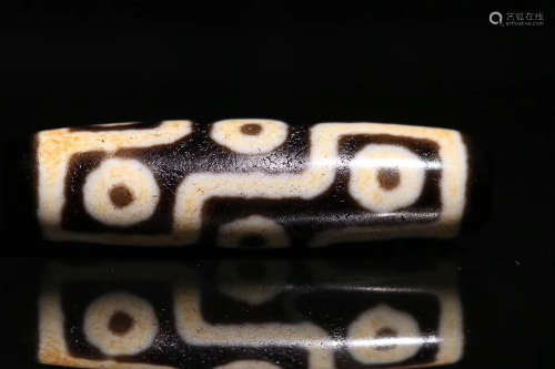 A TIBETAN NINE-EYE DZI BEAD