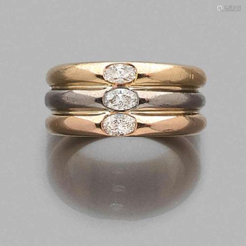 CARTIER ANNEAU TROIS ORS DIAMANTS A gold and diamond ring by CARTIER.