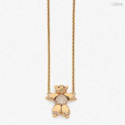 CHOPARD COLLIER “OURSON” A diamond, sapphire and gold pendant and chain by CHOPARD.
