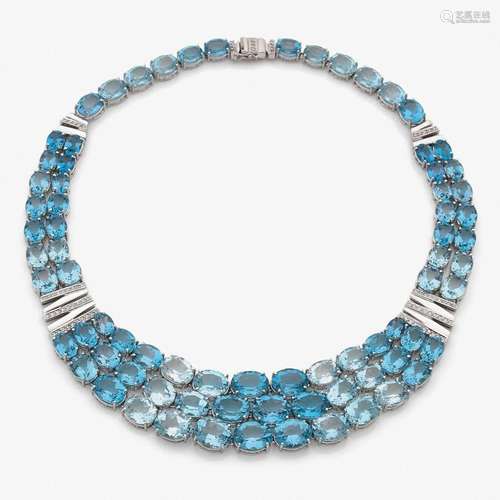 COLLIER TOPAZES BLEUES A topaz, diamond and gold necklace.