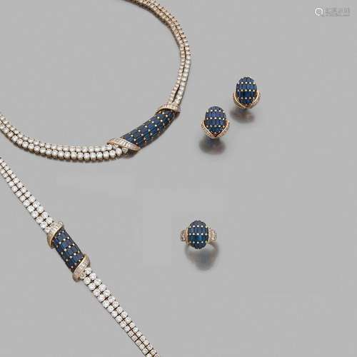 MOUAWAD ANNÉES 1980 PARURE DIAMANTS ET SAPHIRS A diamond, sapphire and gold set by MOUAWAD, circa 1980.