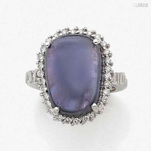 BAGUE SAPHIR CABOCHON A 18,15 carats sapphire, diamond and gold ring.