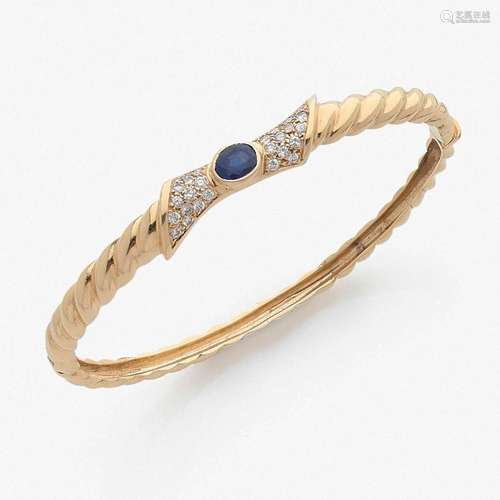 FRED ANNÉES 1980 BRACELET JONC A diamond, sapphire and gold bangle by FRED, circa 1980.