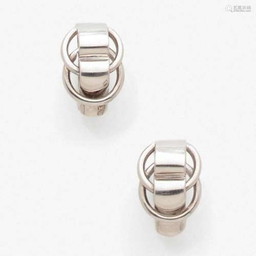 HERMÈS PAIRE DE BOUCLES D’OREILLES A silver pair of ear clips by HERMES.