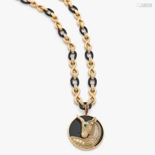 ANNÉES 1970 SAUTOIR TAUREAU An onyx, agate, ivory, diamond and gold pendant and long chain, circa 1970.