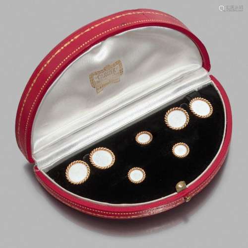 CARTIER 1940 PARURE DE SMOKING A white enamel and gold smoking set by CARTIER, circa 1940.