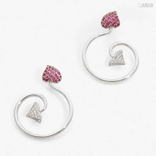 DIOR PAIRE DE MOTIFS D’OREILLES A diamond, ruby and gold pair of earrings by DIOR.