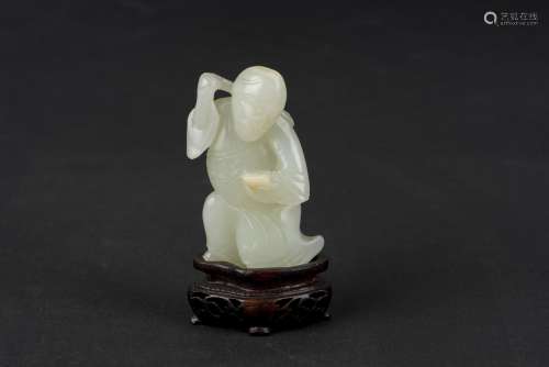 A PALE GREEN JADE CARVING OF FIGURE, MID-QING DYNASTY