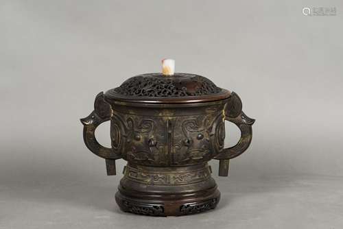 A BRONZE CENSER WITH COVER