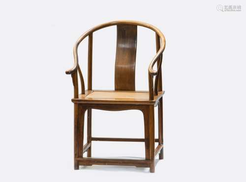 A HUANGHUALI CONTINUOUS HORSESHOE-BACK ARMCHAIR (Y)