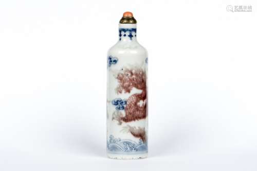 A COPPER-RED AND BLUE-AND-WHITE SNUFF BOTTLE, QING DYNASTY