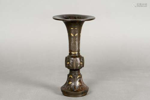 A GILT-BRONZE BEAKER VASE