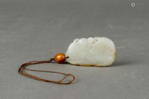 A PALE GREEN JADE 'HORSE AND MONKEY' PENDANT