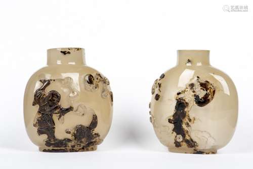 A PAIR OF CARVED AGATE SNUFF BOTTLES