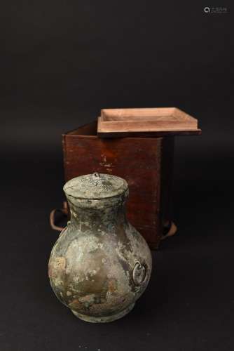 A BRONZE JAR WITH TWO CIRCLE HANDLES