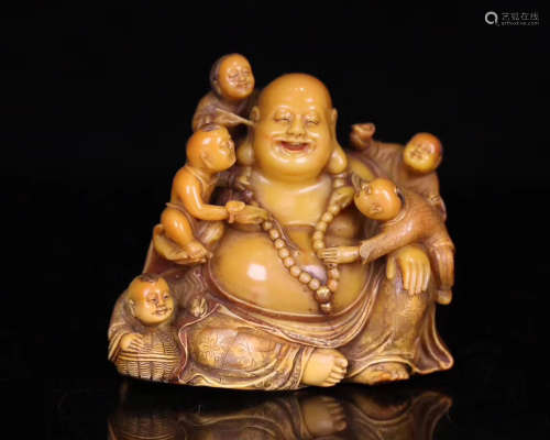 A SOAPSTONE CARVED LAUGHING BUDDHA STATUE