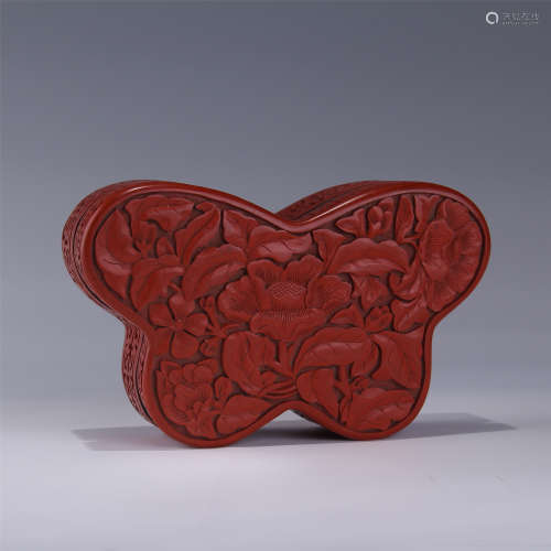 A RED LACQUERWARE BUTTERFLY-SHAPED COVERED BOX