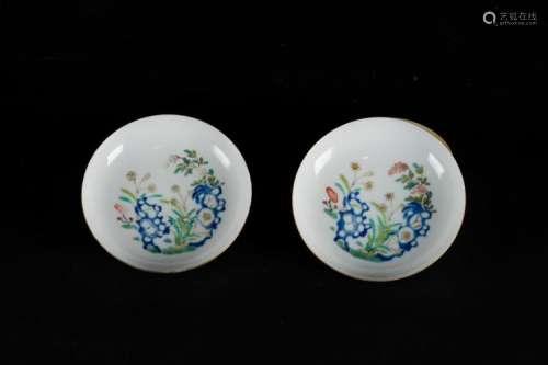 Chinese Art A pair of doucai saucer dishes enamelled with vegetal motifs and painted with underglaze blue. Bearing a six character Yongzheng mark within double circle at the base China, 20th century