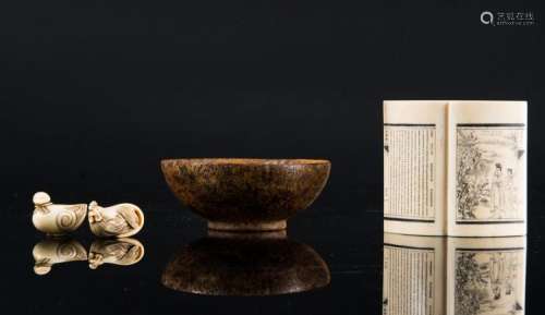 Chinese Art A stone bowl, an ivory book shaped carving and two netsuke China and Japan, 19th century