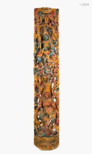 Indian Art A large wooden polychrome fretwork panel portraying a female multiarmed deity within sprays and Yakshas India, 19th century